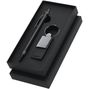 A black metal pen and keyring set, presented in a sleek black box. The keyring features a leather detail.