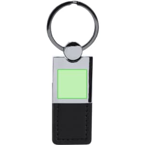 A keyring featuring a rectangular metal attachment, with a green square and a black leather base.