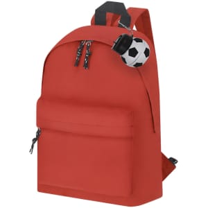 A red backpack with a front pocket and a small soccer ball keychain attached to the zipper.