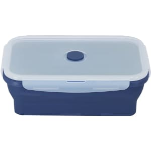 A navy blue lunch box with a clear plastic lid and a central button closure. Features a logo on the side.