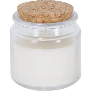 A glass jar candle with a cork lid, filled with white wax. The jar has a sleek, transparent design.