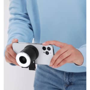 A handheld phone attachment featuring a black body and a silver ring light, designed for enhanced photography.