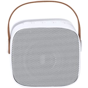 A compact white speaker with a black mesh front and a brown leather carrying strap.