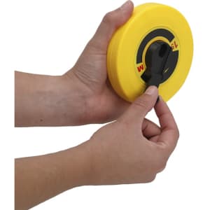 A yellow Nathor 15m tape measure is held in a hand, showcasing its black pulling mechanism.