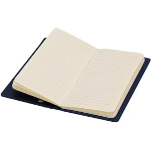 An open navy Glimmer Notepad featuring lined, cream-coloured pages inside.