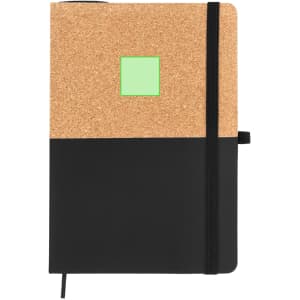 A cork and black notebook with an elastic band and a green square on the front. Features a logo on the cover.