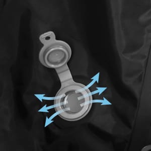 A black vacuum backpack features a grey valve with a flap for air release. The design includes directional arrows around the valve.