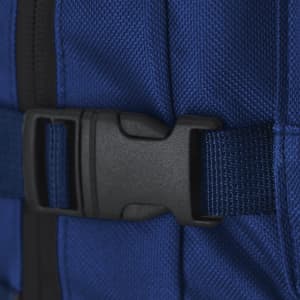 A close-up of a blue backpack featuring a black plastic buckle and textured fabric.