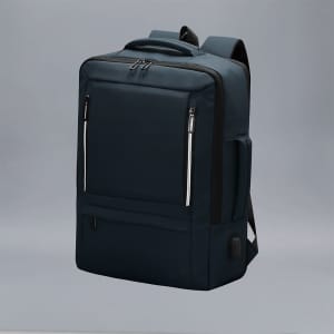 A navy blue Javelin Backpack with multiple zippered compartments and a branding logo. It features padded shoulder straps.