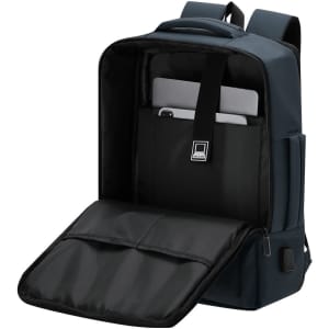 A navy Javelin backpack with a spacious interior, featuring a black padded section for a tablet or laptop and multiple compartments.