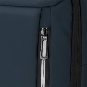 A close-up of a blue backpack featuring a zippered pocket and a sleek design. It includes branding elements.