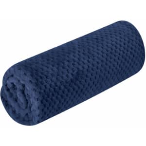 A navy blue Iridian Blanket, rolled and textured, featuring a soft, plush surface. Includes a logo.