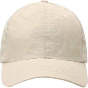 A beige cap with a rounded crown and a curved brim, featuring a logo on the front.