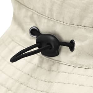 A beige cap featuring a slider and drawcord for adjustability, with eyelets for ventilation. It has a logo on the side.