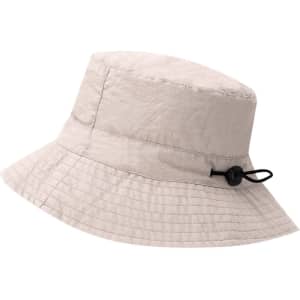 A beige Dagger Hat with a wide brim, featuring an adjustable toggle for a secure fit. Includes a logo.