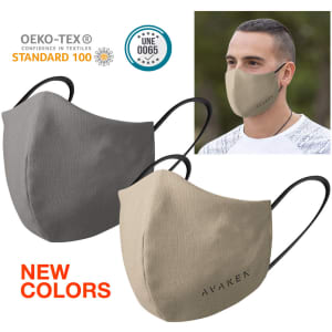 A pair of reusable hygienic masks in grey and beige, featuring a logo, displayed on a model.