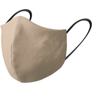 A beige reusable hygienic mask with black straps, featuring a simple design and a logo.