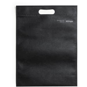 A black tote bag with a handle, made from 70% recycled material, featuring a logo.