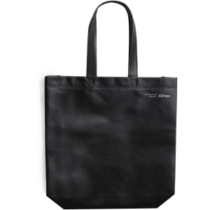A black tote bag with two handles and a small logo on the side.