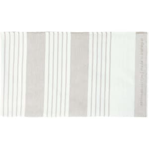 A striped towel featuring shades of white and light brown, with a subtle logo on one edge.