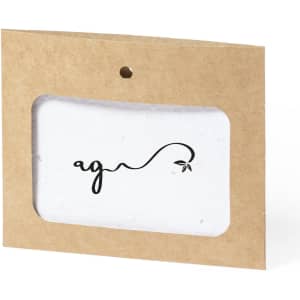 A seed paper badge in a natural brown card holder, featuring a simple leaf design and a logo.