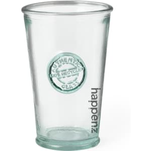 A drink cup in clear, recycled plastic featuring a round logo and the word "happen."