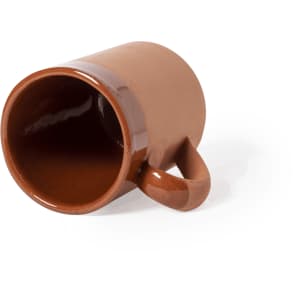 A brown coffee mug with a glossy finish and a curved handle, placed on its side.