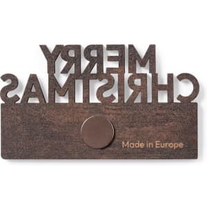 A brown magnet with the words "Merry Christmas" cut out, featuring a circular attachment. It has a logo or branding detail.