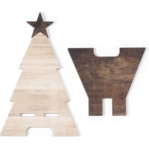 A wooden phone stand set featuring a Christmas tree and a star, in light and dark wood tones.