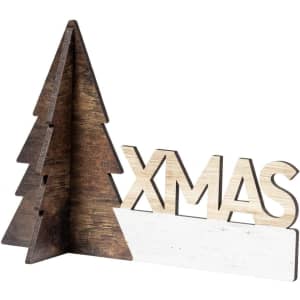 A wooden Christmas decoration featuring a brown tree design and the word "XMAS" in light wood.