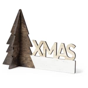 A wooden Christmas decoration featuring a tree silhouette and the word "XMAS" in a natural and white finish.