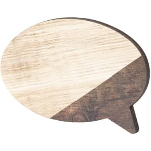 A wooden speech bubble magnet featuring a natural wood finish with a divided light and dark colour scheme.