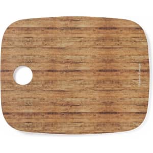 A wooden kitchen cutting board with a rounded corner and a small hole, featuring a natural, textured finish.