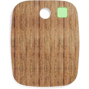 A wooden kitchen cutting board with a rounded edge and a hole for hanging. It has a natural wood grain finish.