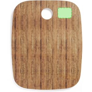 A wooden-themed chopping board with a rounded cut-out at the top and a smooth surface.