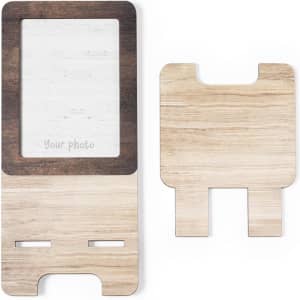 A wooden photo frame holder featuring light and dark wood tones with a rectangular opening for a photo. It has a branding logo.