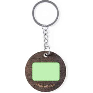 A round keyring with a silver chain, featuring a dark textured surface and a green blank area for personalisation.