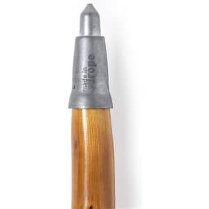 A walking pole with a wooden shaft and a metallic tip. The metal section has a logo and text.
