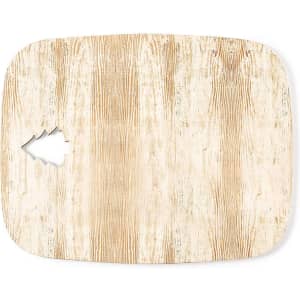 A wooden cutting board with a natural wood grain design and a tree-shaped cutout in one corner.
