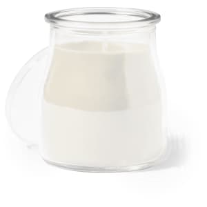 A white aromatic candle in a clear glass jar with a handle, showcasing a simple and elegant design.