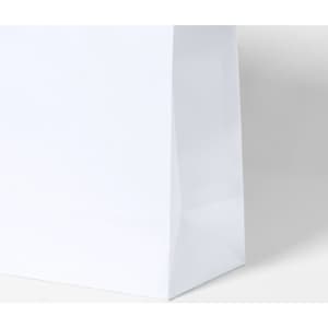 A white paper bag with a flat base, featuring a subtle glossy finish and a branding logo on the side.
