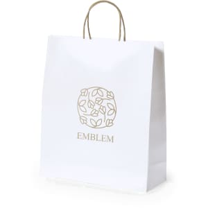 A white paper bag with a decorative logo and brown handles. Suitable for various promotional uses.