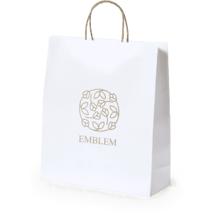A white paper bag with a floral logo and matching handles, featuring a gold design.