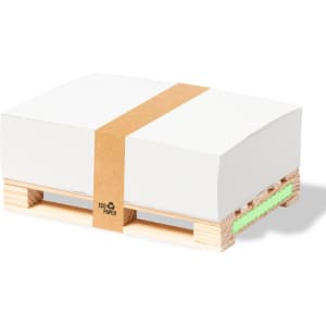 A stack of white notepads secured with a brown band, resting on a wooden pallet. The notepads feature a green base.