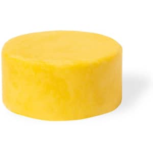 A round yellow shampoo bar on a white background, featuring a smooth, solid surface.