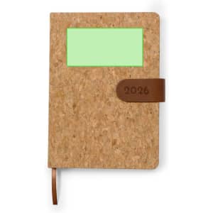 A cork diary featuring a green window and a brown leather strap, with a year embossed on the cover.
