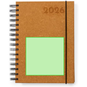 A brown spiral-bound diary with a light green square on the cover and an elastic band closure.