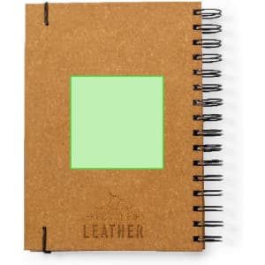 A brown spiral-bound diary with a blank green rectangular insert on the front and a leather branding imprint.
