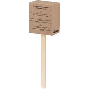 A wooden stick with a square, brown pack containing wildflower seeds, featuring a logo and text on the front.