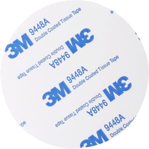 A round double-sided tape with 3M branding, featuring a white surface covered in blue printed text.